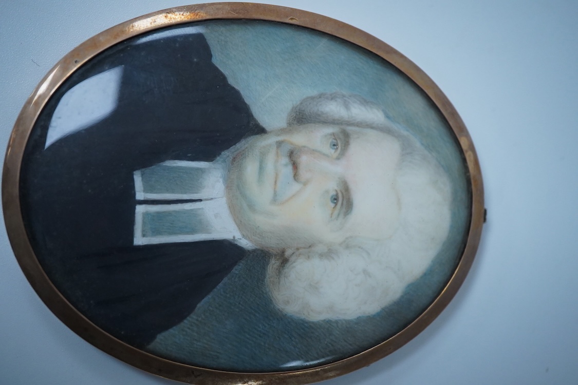 An early 19th century, English School, Portrait of a clergyman, portrait miniature, watercolour on ivory, housed in a gilt metal frame, 7.5cm high CITES Submission reference 2DG4HQ4U